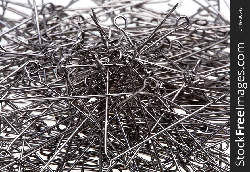 Many steel tailor's pins close up