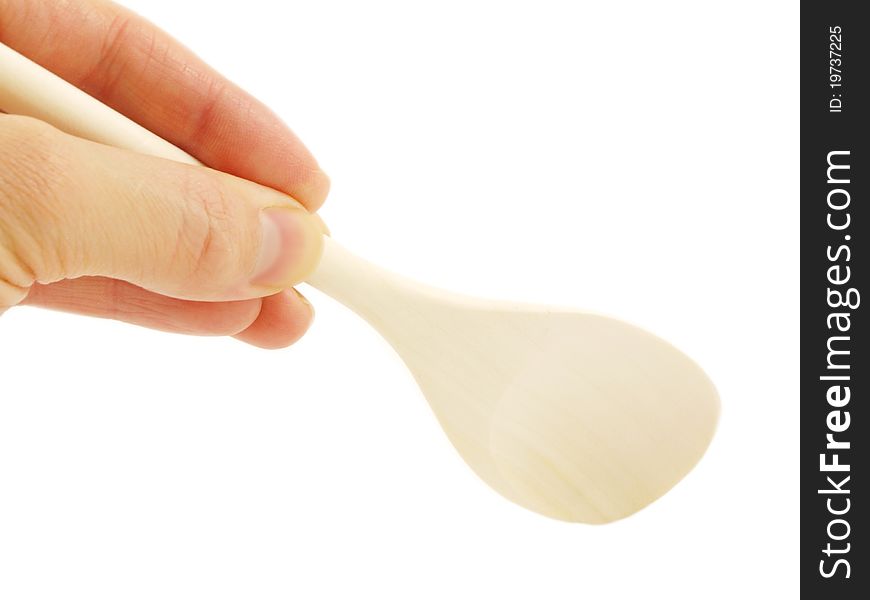 Person holding a wooden spatula, isolated towards white background