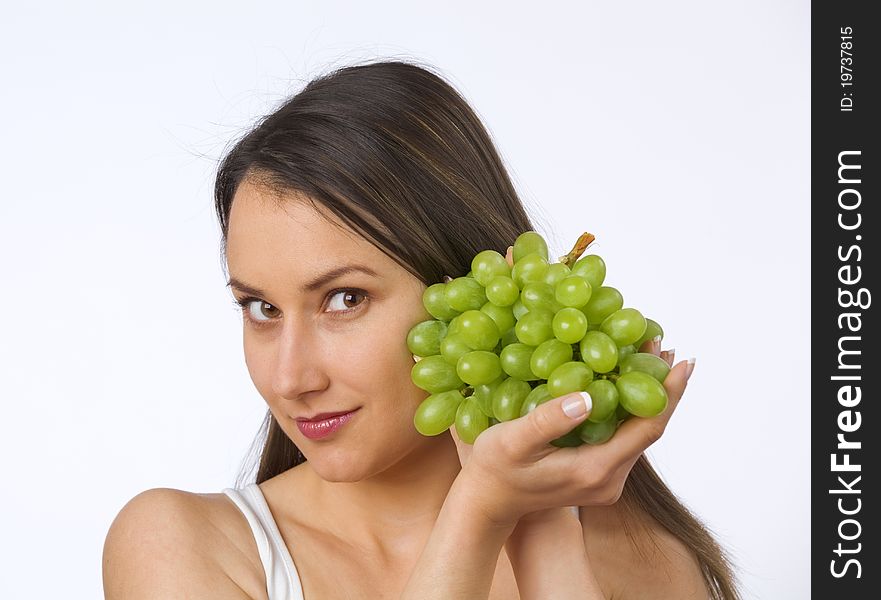 Young woman holding fresh grapes. Young woman holding fresh grapes