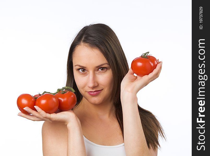 Young woman holding fresh tomatoes. Young woman holding fresh tomatoes