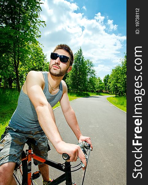 Young man cyclist sitting on bicycle