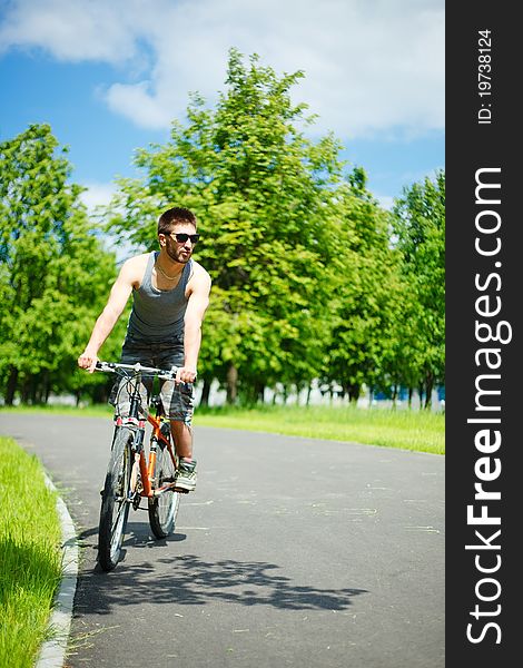 Young man cyclist sitting on bicycle