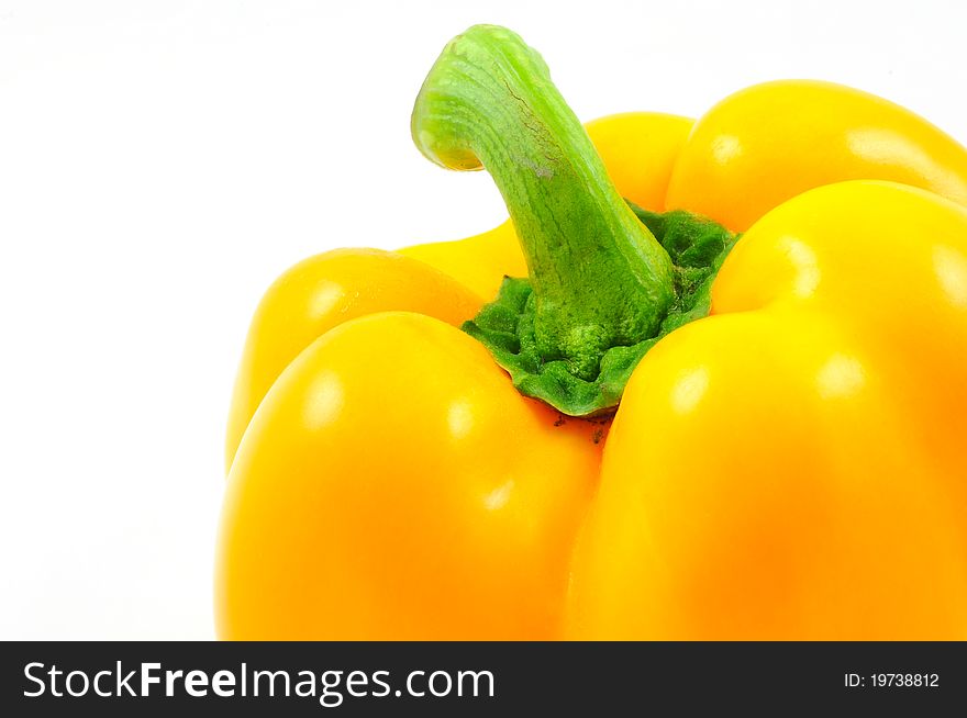 Isolated close up yellow bell pepper on white background