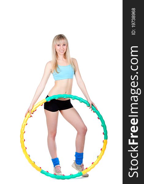 Young attractive woman holding hula hoop isolated over white background. Sport concept of girl exercising with hula hoop, twirling. Vertical shot. Young attractive woman holding hula hoop isolated over white background. Sport concept of girl exercising with hula hoop, twirling. Vertical shot.