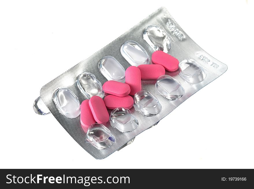 Many pills peel off from pack isolated on white background.