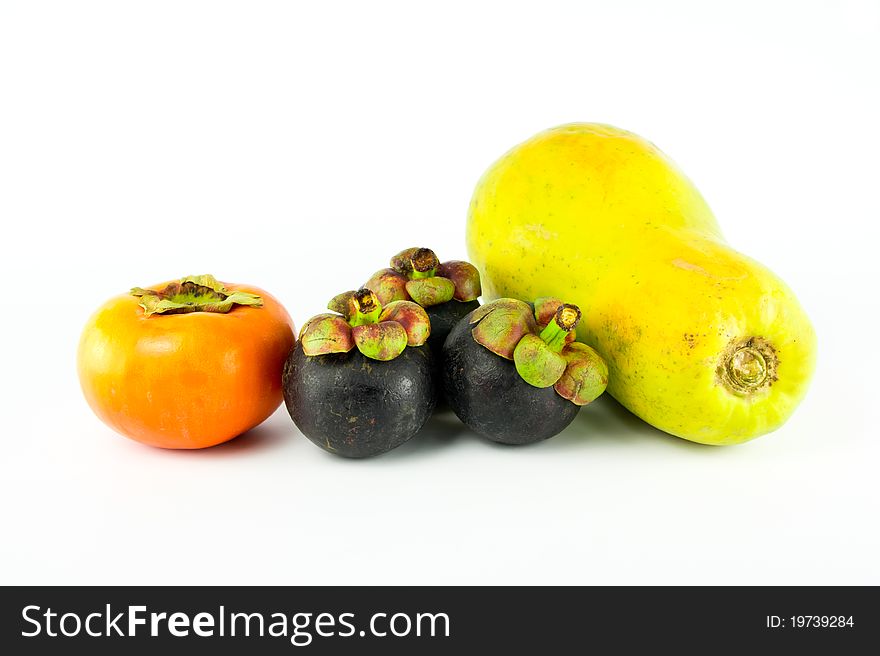 Tropical fruits: persimmon, mangosteen, papaya isolated on white