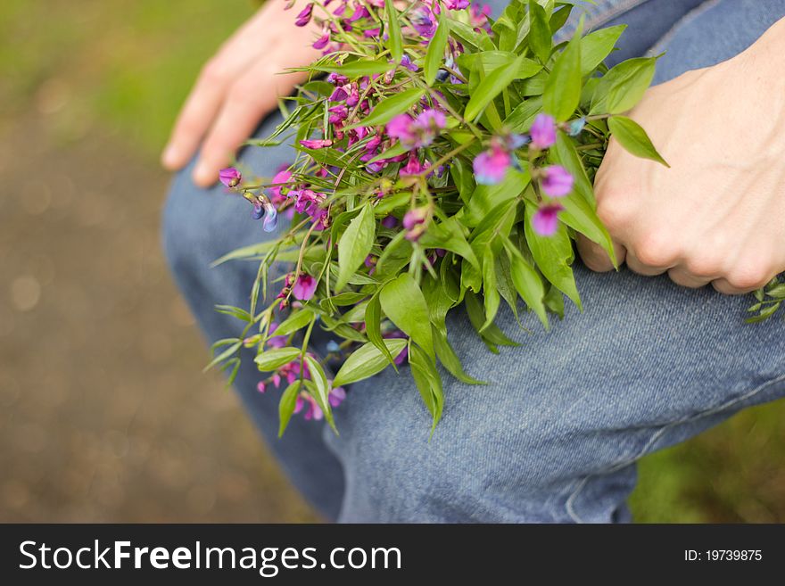 A bouquet of wildflowers in hand