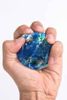 Hand Squeezing Earth Royalty Free Stock Photography Hand Squeezing Earth Royalty Free Stock Photography