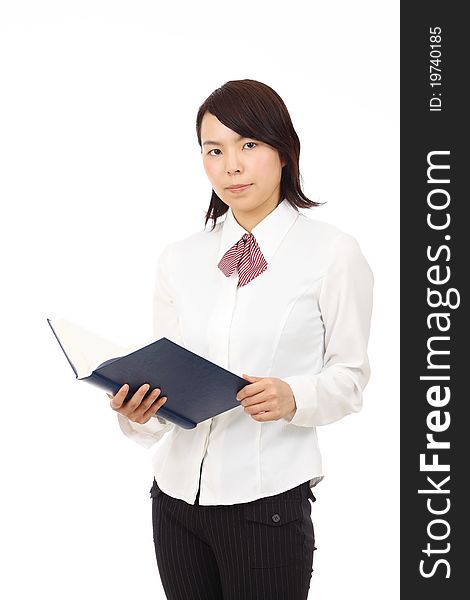 Young japanese business woman holding a book. Young japanese business woman holding a book
