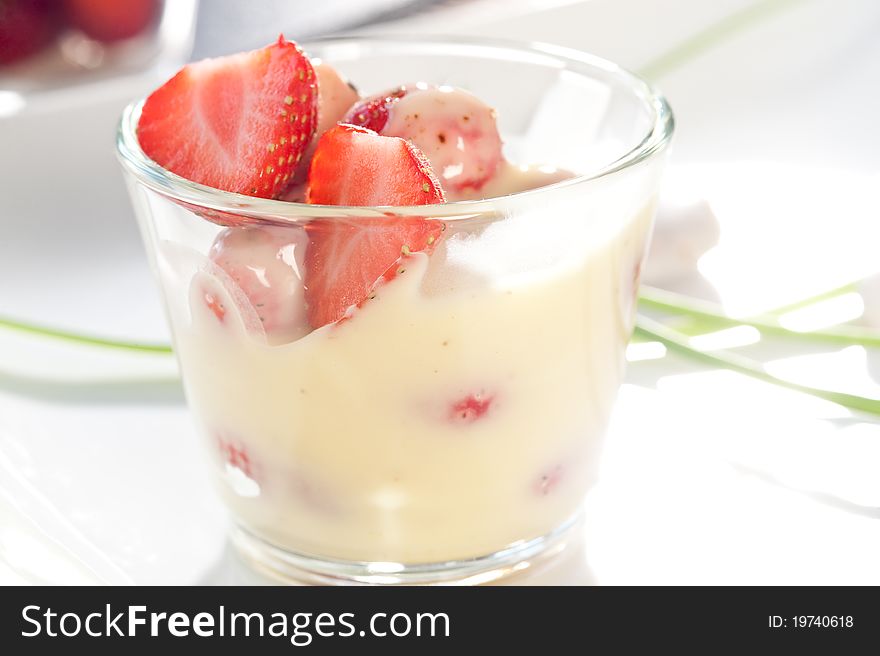 Strawberries served in a glass plate on