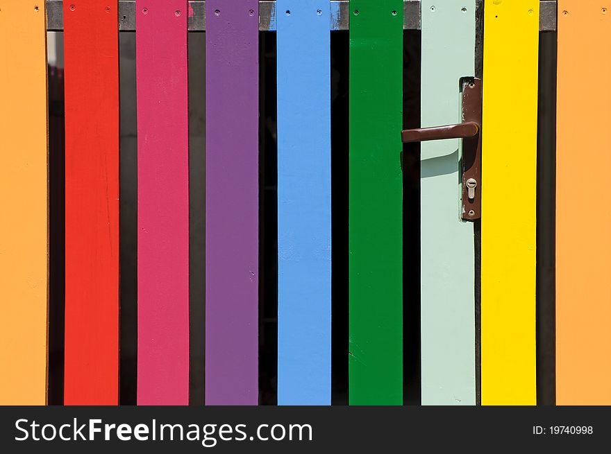 Colorful fence with a door handle