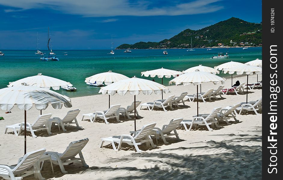 Very nice white beach umbrella at nice dark blue sky