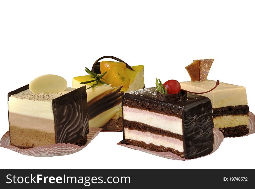 Cakes fruit different on the white isolated background