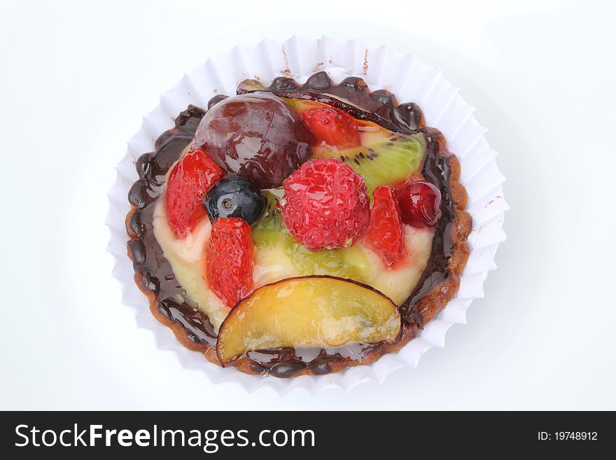 Strawberry tart with caramelized blackberries and blueberries