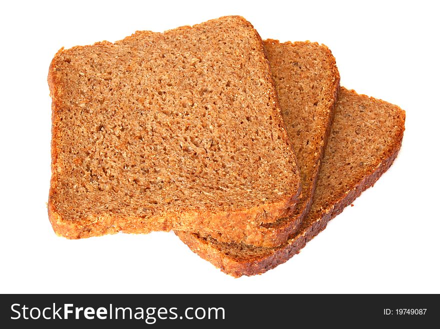 Three pieces of chopped wholemeal bread isolated on white