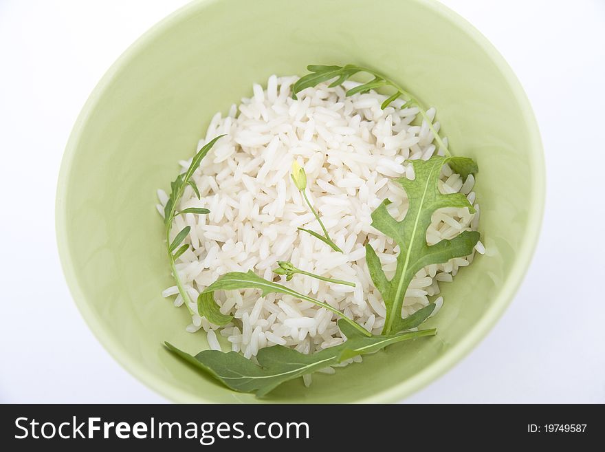 Boiled white rice with terragon leaves in green bowl. Boiled white rice with terragon leaves in green bowl