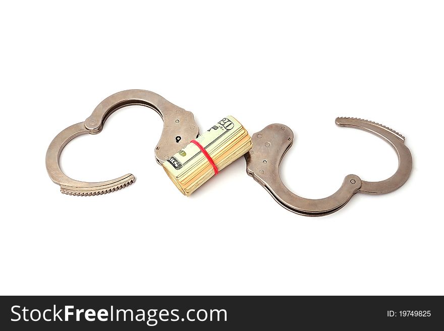 Handcuffs and dollars on a white background