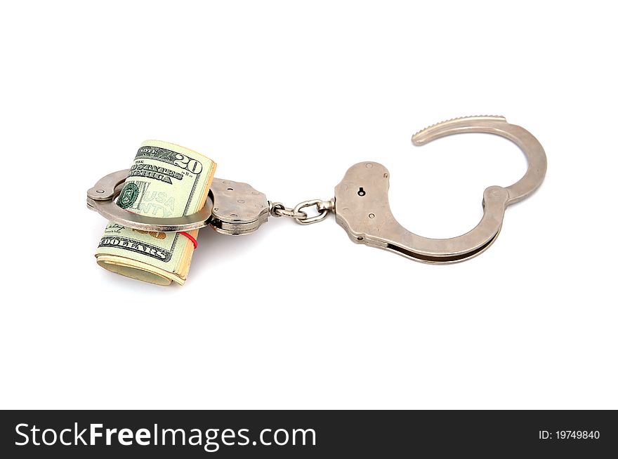 Handcuffs and dollars on a white background