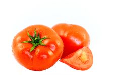 The Juicy Ripe Tomatoes In Drop Of Water On White Stock Images