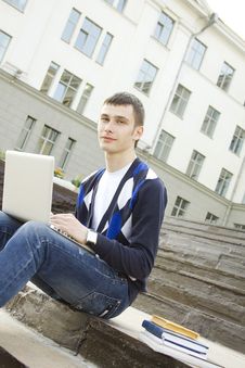 Young Student Working On A Laptop Royalty Free Stock Photos