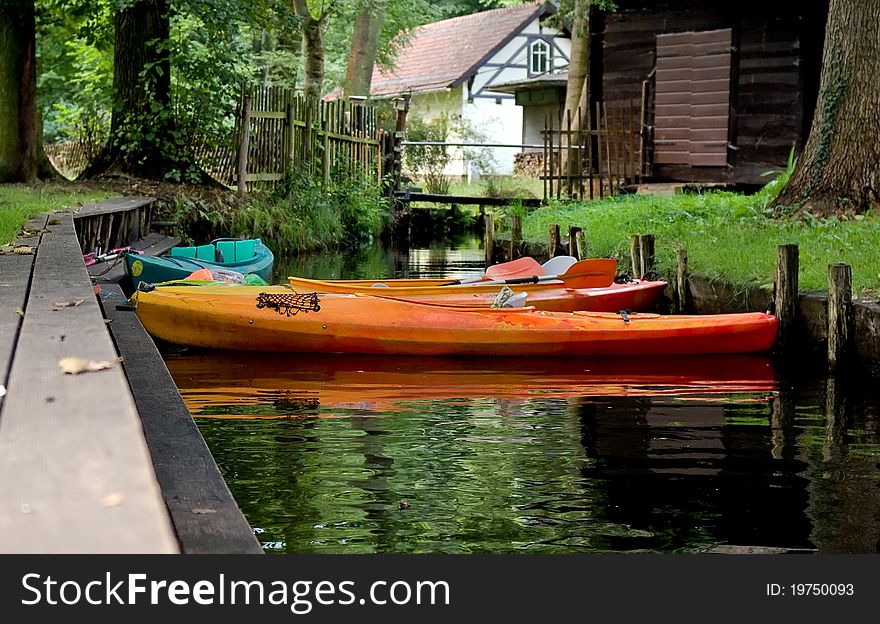 Three recreation kayaks on the dock. Three recreation kayaks on the dock