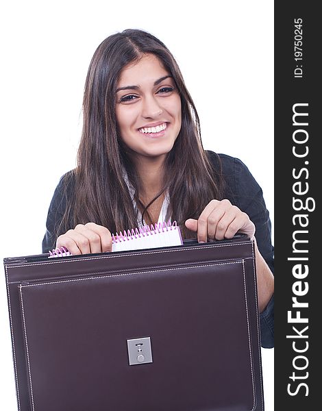 Businesswoman holding a briefcase and smiling