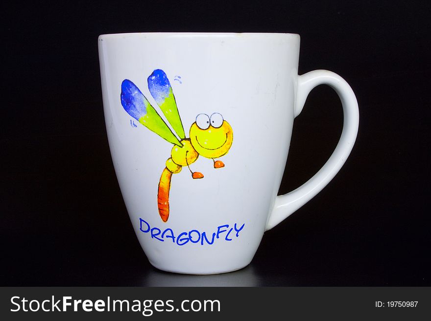 Coffee Cup And Dragonfly