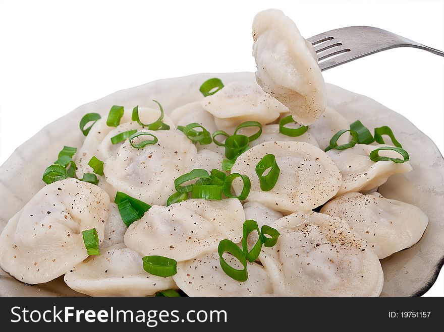 Dumplings on a plate on white