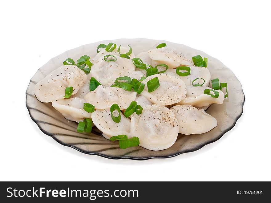 Dumplings on a plate on white