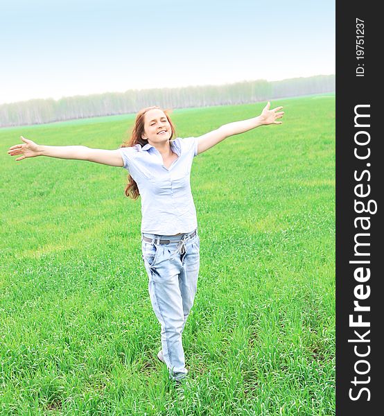 Girl walks in the field