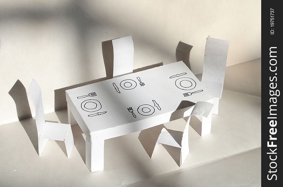 Paper and table models made out of white paper. Paper and table models made out of white paper