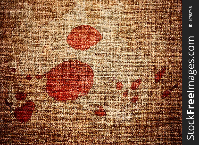 Close up of red paint drops on canvas background