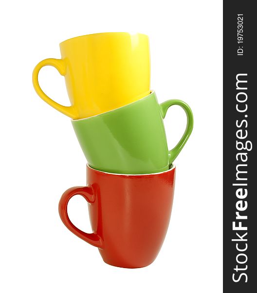 Colored ceramic cups isolated on white background with clipping path. Colored ceramic cups isolated on white background with clipping path