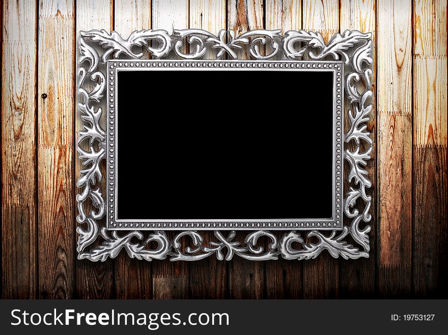 Frame on a wooden background