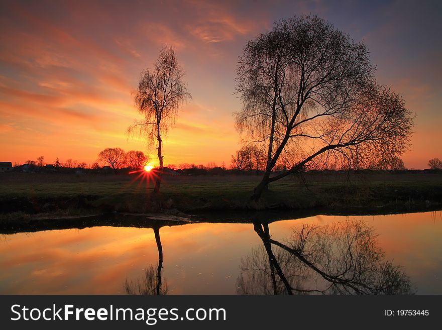 Sunset on the river bank