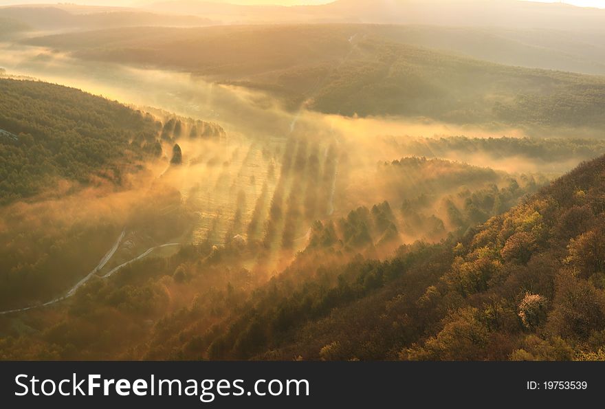 Misty mountains on summer sunset