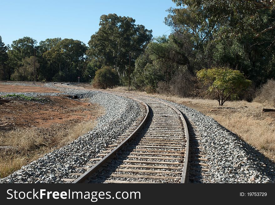 A winding railway line heading out of town. A winding railway line heading out of town