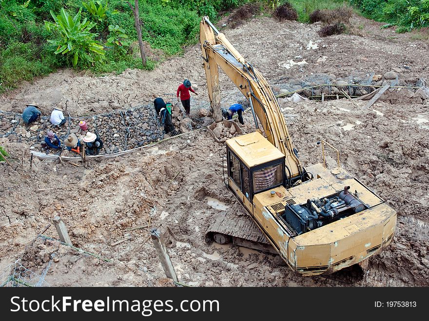 Construction site with yellow tractors