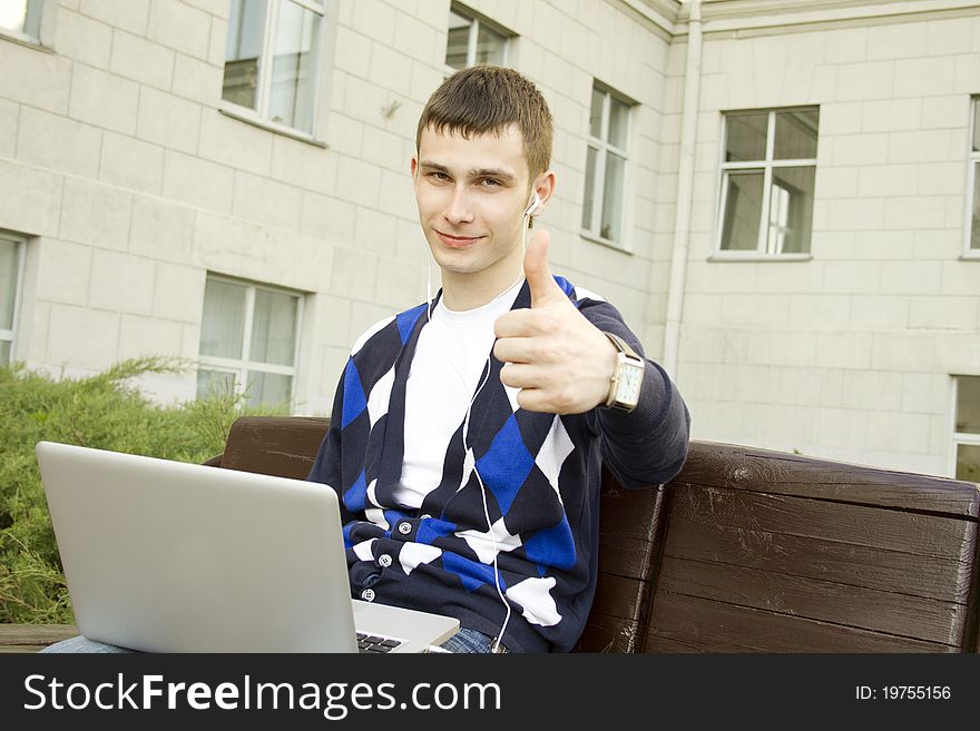 Young Student Working On A Laptop