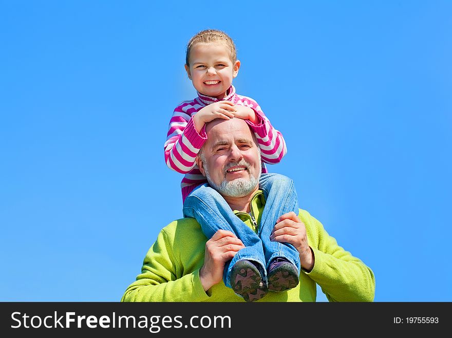 Grandfather and grandaugther happy together