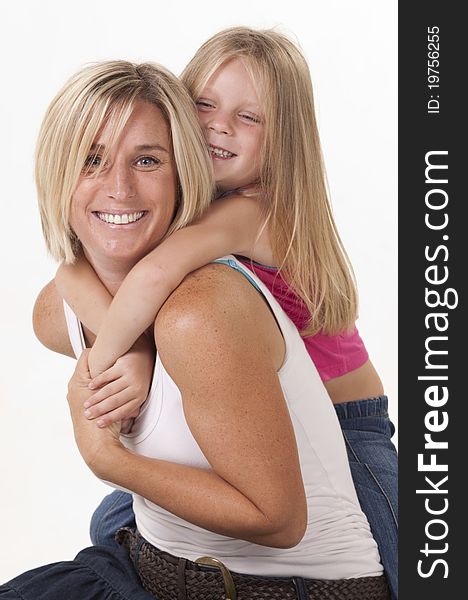 Attractive blonde mother and daughter, in a loving embrace. Attractive blonde mother and daughter, in a loving embrace.