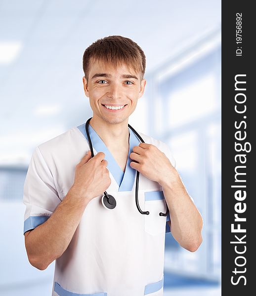 Medical doctor with stethoscope in hospital