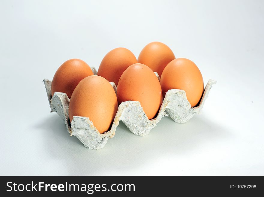 Cardboard packaging from 6 eggs isolated on white background.