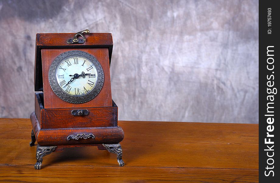 Old Vintage clock on old wooden set