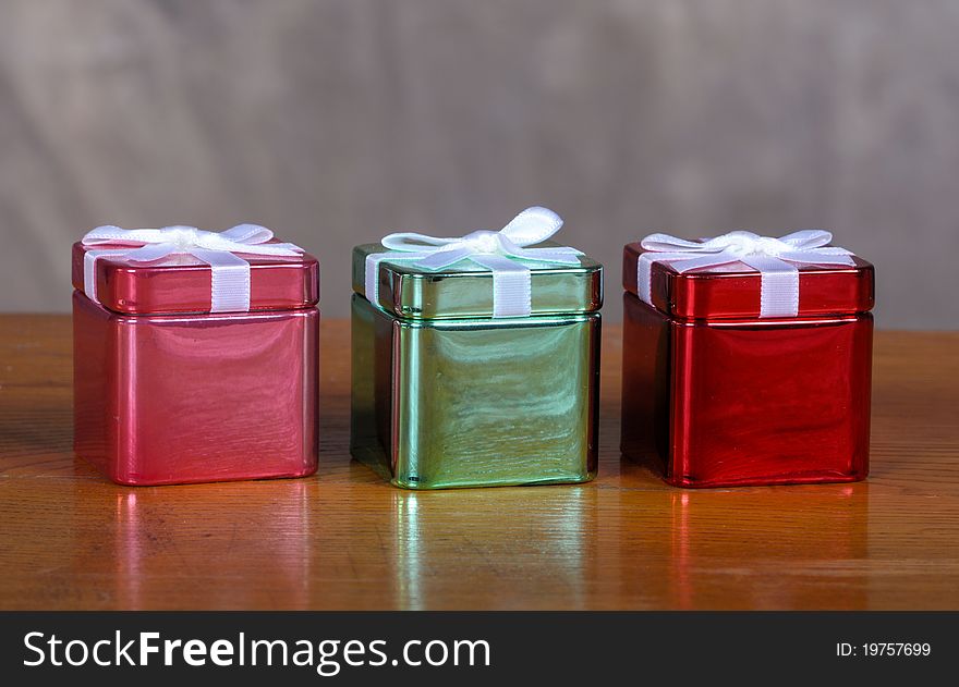 Tin Christmas boxes on old vintage table