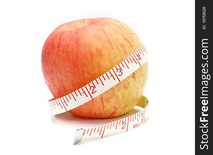 Red Apple and a measure tape, diet concept