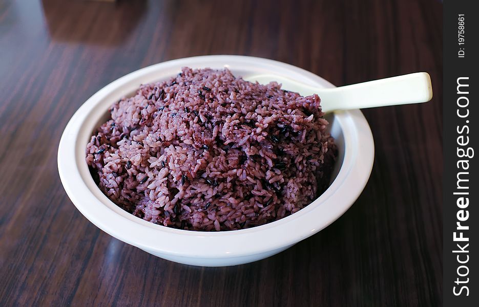 Black sticky rice in white round bowl