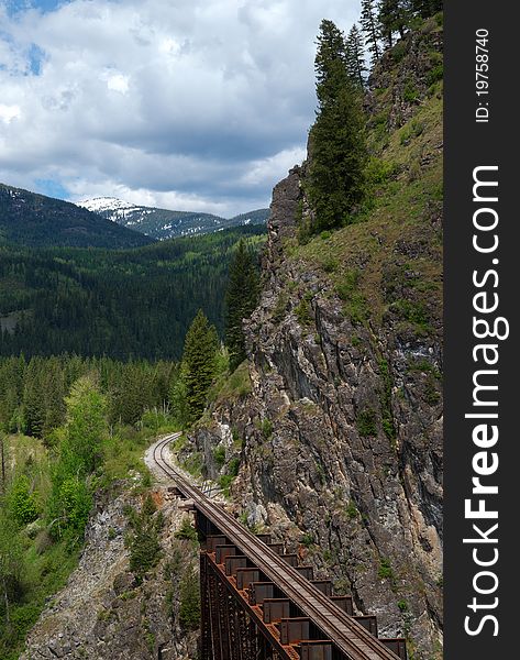 Railroad tracks lead into the mountains of British Columbia, Canada. Railroad tracks lead into the mountains of British Columbia, Canada