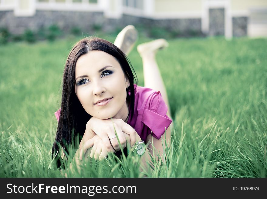 Beautiful Young Girl Lying On The Grass