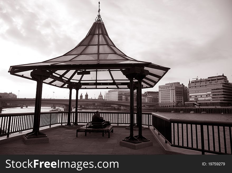 Couple looking at London Bridge and the River Thames in London, England, UK